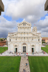 The facade of the Pisa Cathedral and the leaning Tower (on the background) in Piazza dei Miracoli in Pisa, Tuscany, Italy. The view is from the Baptistery. 