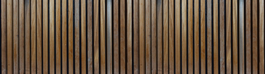 Wood background banner panorama long wide - Brown wooden acoustic panels wall texture, vertical boards, seamless pattern