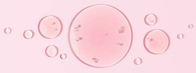 Serum oil sample round shape drops on pink background, 3d rendering gel with hyaluronic acids