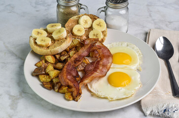 fried eggs with bacon and home fries