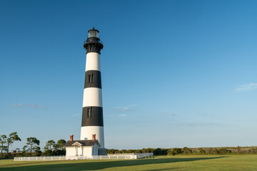 Bodie Island Lighthouse at dusk golden hour, Outer Banks, North Carolina.