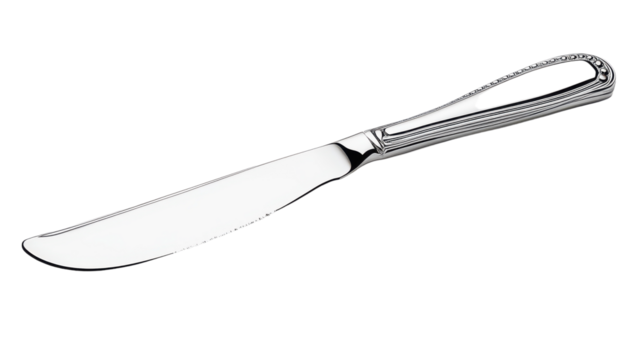 Elegant stainless steel butter knife resting on a smooth surface, reflecting light in a cozy kitchen setting
