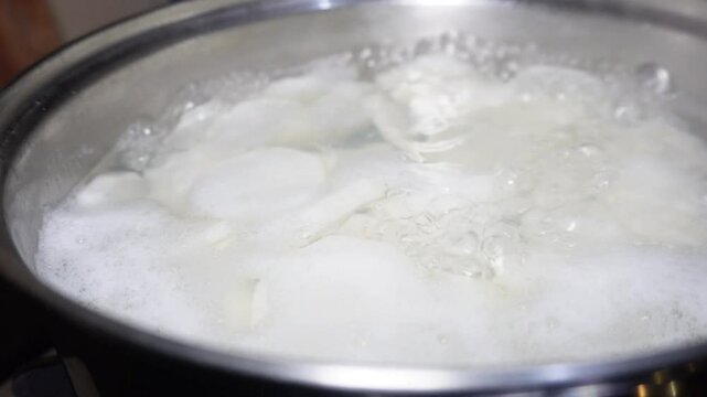 the process of boiling turnips, as a basic ingredient in making the soto bandung dish