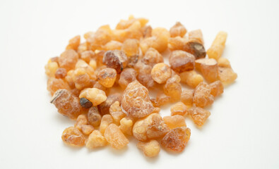 Frankincense or olibanum aromatic resin isolated on white background used in incense and perfumes.