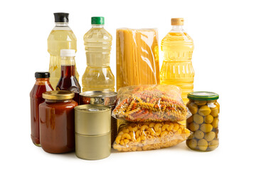 Foodstuff for donation isolated on white background with clipping path, storage and delivery. Various food, pasta, cooking oil and canned food.
