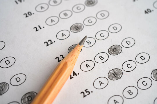 Answer sheets with pencil drawing fill to select choice education.