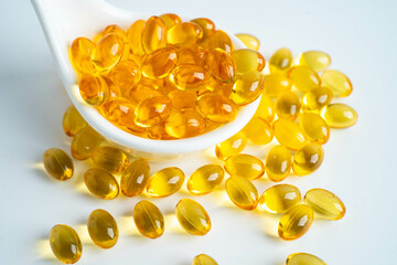 Fish oil capsules omega 3 vitamin with EPA and DHAvon white background.