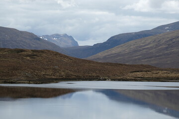 Reflection on a lake in Scottish the mountains