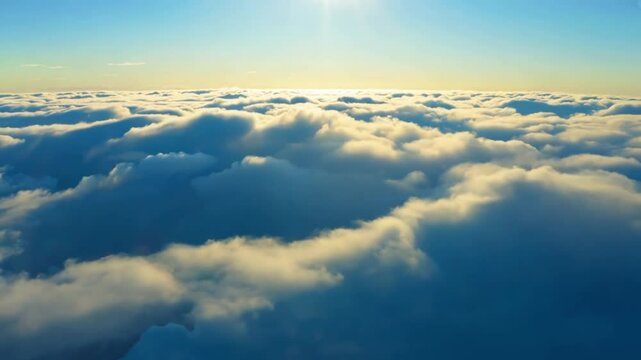 Aerial view of cumulus cloud formation at Sunrise. High-altitude sunshine breaking through morning clouds.