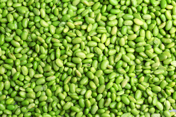 Fresh edamame beans as background, top view