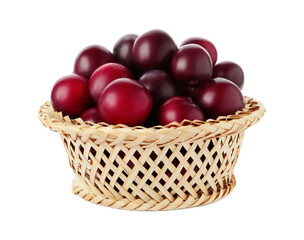 Fresh ripe plums in wicker bowl isolated on white