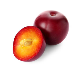 Whole and cut ripe plums isolated on white