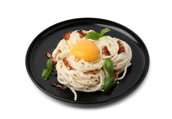 Delicious pasta Carbonara with egg yolk, bacon and basil isolated on white