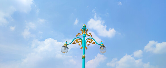 Vintage Street Lamp with blue sky background, retro java style. summer day