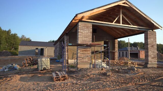 Villa construction. Prefab house under construction. Suburban house Construction. Prefabricated home building. Building a Family Home. View on construction site with Modular house building in suburb. 