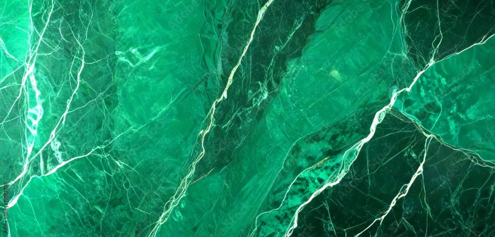 Poster a close-up view dark green marble surface with visible veins and cracks, creating a textured and intricate pattern