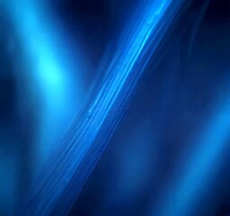 Fototapeta premium a close-up view thin, elongated, and transparent blue line, with a slight curve to the left, against a dark blue background