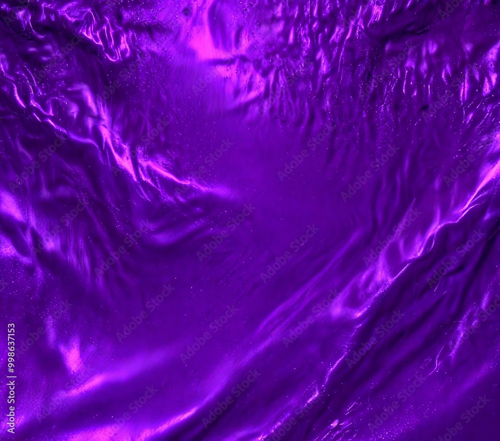 Leinwandbilder a close-up view purple fabric with a shiny, wavy texture The fabric appears to be made of satin or a similar material, and taken from a slightly elevated