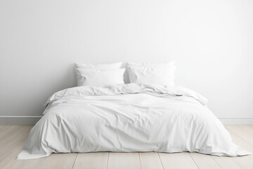 Minimalist bedroom with white bedding on a light wooden floor and a plain white wall backdrop, creating a clean and serene atmosphere