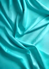 Obraz premium Turquoise fabric, with a crumpled and flowing texture, is displayed in the
