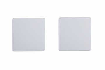 two white square magnets with a white background