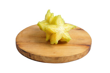 Delicious starfruit slices (Belimbing) on round wooden base. (Averrhoa carambola, star apple, starfruit). Isolated on white background with clipping path