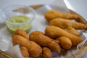 Pa Thong Ko, a popular Thai deep-fried dough or Thai-style Chinese cruller, served with Pandan Custard