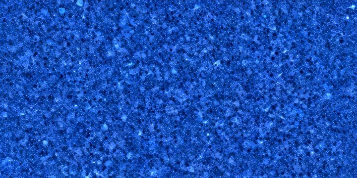 a close-up view dark blue, speckled surface, resembling a stone or granite texture The does not contain any discernible text or countable objects