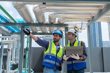 Engineers Collaborating and Smiling in Industrial Setting © Washburn