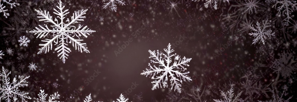 Aufkleber a dark background with numerous white snowflakes scattered throughout, creating a sense of depth and movement The snowflakes vary in size and shape, with some appearing