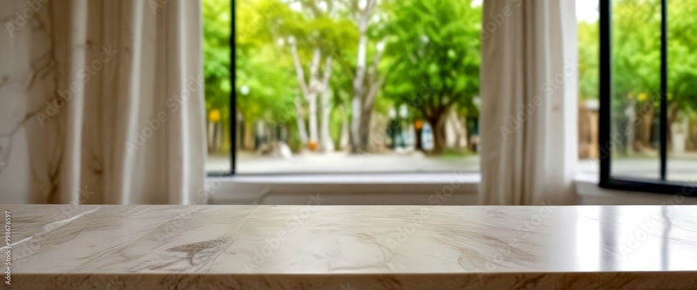 Poster A marble-topped table sits in the foreground, with a blurred view park visible through a window in the background