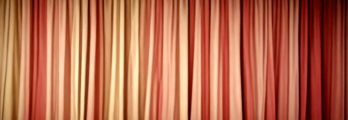 A close-up view curtain with vertical stripes in various shades of pink and beige