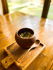 Dumplings in authentic Ukrainian dishes on a wooden table. Concept of Ukrainian cuisine