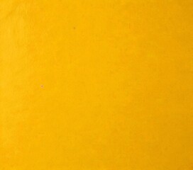 Fototapeta premium A simple, unadorned yellow background with a subtle texture