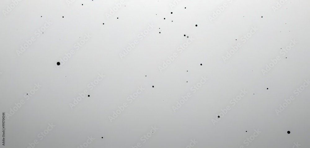 Poster a white background with numerous small black dots scattered across it, creating a sense of randomness and depth