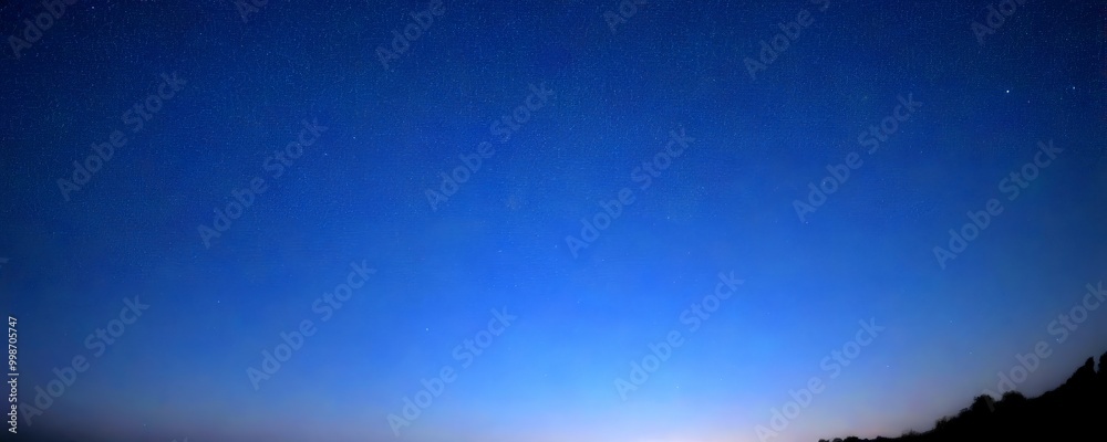Poster a starry night sky with a gradient of blue hues, featuring a few distant stars and a silhouette of t