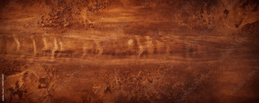 Aufkleber a close-up view of a textured surface with a reddish-brown hue, featuring a pattern of small lines and spots.
