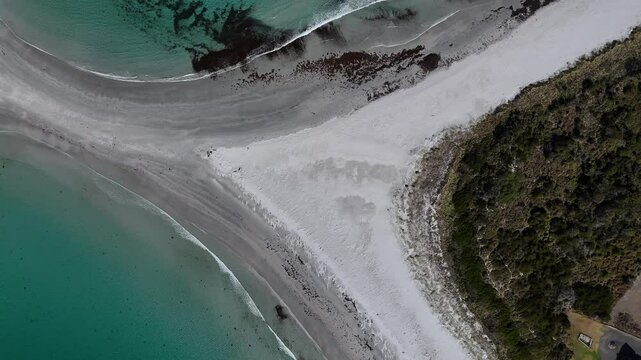 White sand beach connected to a sandbar towards Diamond Island, aerial top down