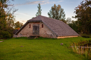 Obraz premium Historical Stone Cottage at Sunset