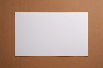 there is a white square paper on a brown surface