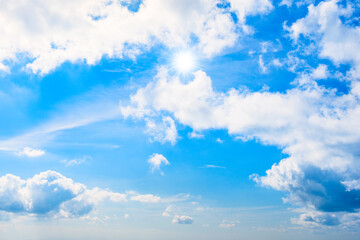 Blue sky and clouds with sun rays, sky background