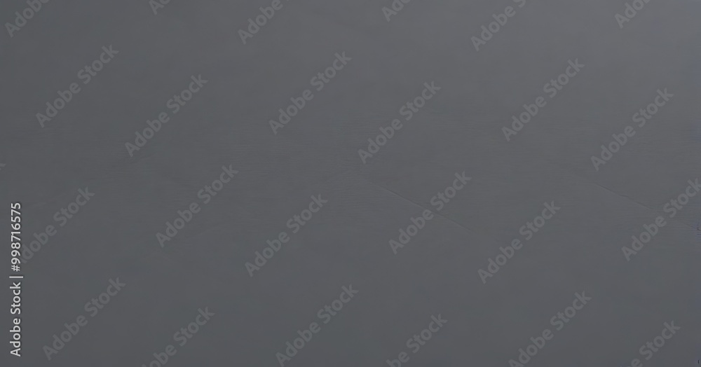 Aufkleber a dark gray background with a diagonal line running across it, creating a sense of depth and perspective