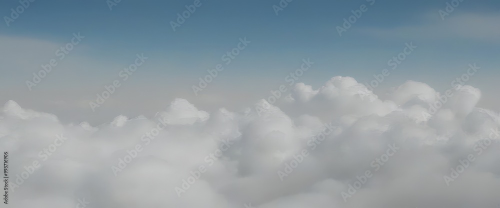 Poster a view of fluffy white clouds against a blue sky, captured from a high vantage point