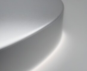 a close-up view curved, metallic surface with a reflective, shiny appearance