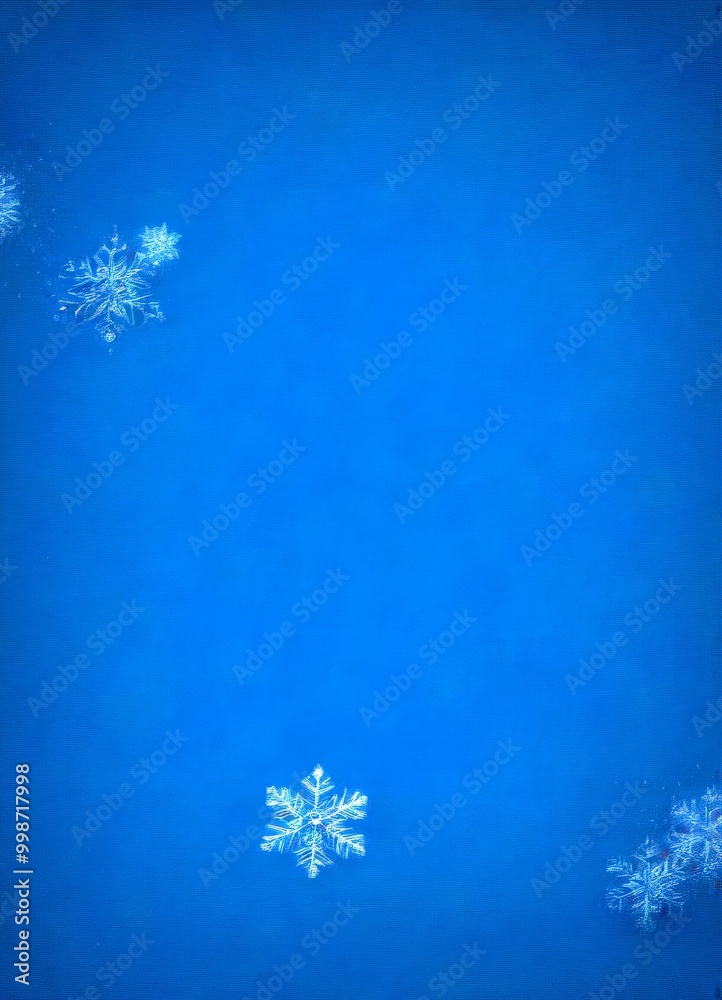Poster Three snowflakes of varying sizes and shapes are scattered across a deep blue background, creating a sense of depth and movement
