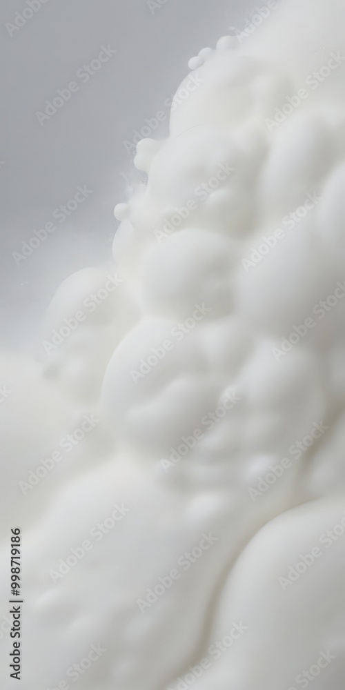 Poster a close-up view white, foamy substance, possibly a cloud-like texture or a white substance with a te