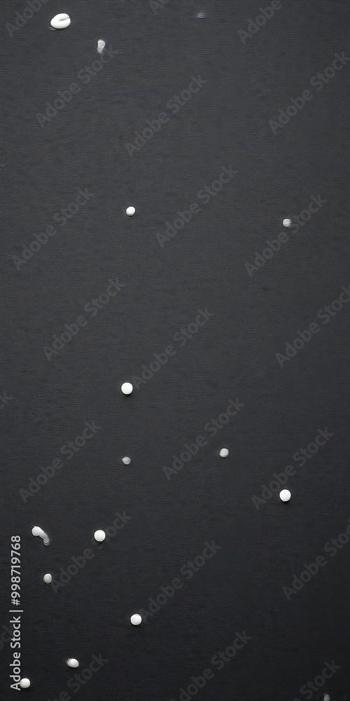 Fototapete a dark background with small white dots scattered across it, resembling stars or celestial objects