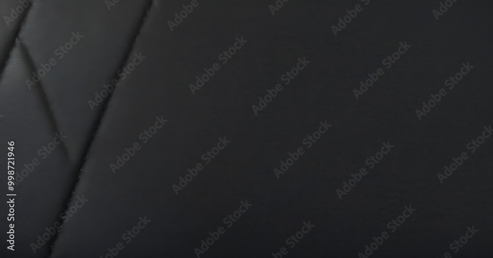Aufkleber A close-up black leather surface with a diagonal line running across it