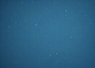 Obraz premium a deep blue body of water with small white specks scattered throughout, creating a sense of movement and depth.