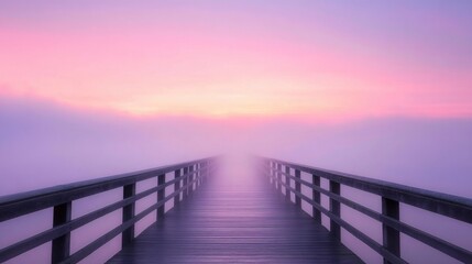 Obraz premium long bridge disappearing into the morning mist at sunrise
